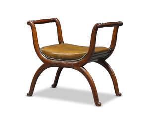 
	
		An Empire mahogany window seat, c.1810, of Egyptian influence, with x-frame, stiff leaf...