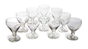 
	
		A collection of ten rummers, 20th century,  with knop and reel stems, on circular feet,...