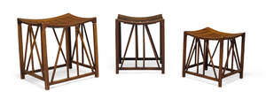 
	
		Liberty & Co (British), a graduated matched trio of mahogany Thebes stools 
		c.1900...