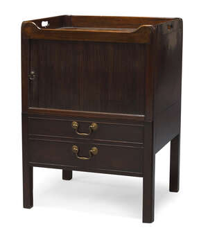 
	
		A mahogany tambour fronted commode, 19th century, the rectangular top with raised gallery...