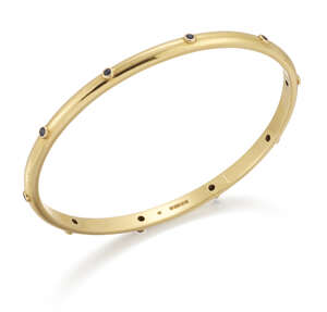 
	
		Theo Fennell, a gold and sapphire bangle, by Theo Fennell accented with circular-cut...
