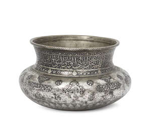 
	
		A Safavid engraved tinned copper bowl, Iran, 17th century, with wide rounded shoulder and...