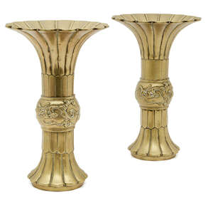 
	
		A pair of Chinese polished bronze vases, gu, 19th century, with petal-lobed flared rims,...