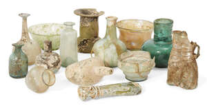 
	
		A group of Roman and later glass vessels 1st Century A.D. and Later, including a bottle...