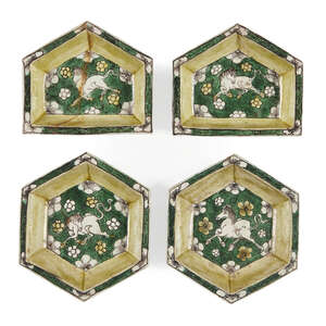 Four Chinese biscuit porcelain sancai hors d'oeurves dishes, Kangxi period, each painted with a horse to the central reserve, 11cm - 13cm wide (4)
		 
	