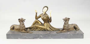 
	
		An Art Deco spelter and faux ivory figure group of a lady admiring herself in a mirror,...