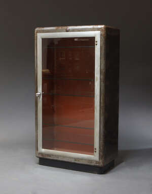 
	
		A steel and glazed pharmaceutical cabinet by Allen and Hanburys ltd, c.1950, of...