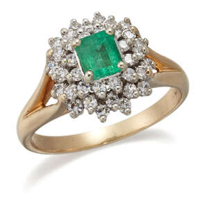 
	
		An emerald and diamond cluster ring, the central claw-set rectangular-cut emerald with...