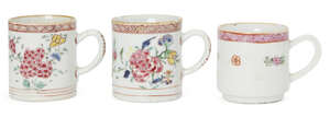 
	
		Three Chinese export porcelain mugs, Yongzheng period, painted in famille rose enamels...