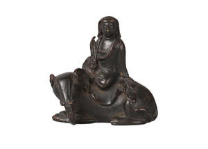 
	
		A Chinese bronze scroll weight, Ming dynasty, 17th century, modelled as Guanyin seated...