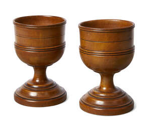 
	
		A pair of English turned treen goblets, c.1800, each with moulded and incised bowl above...