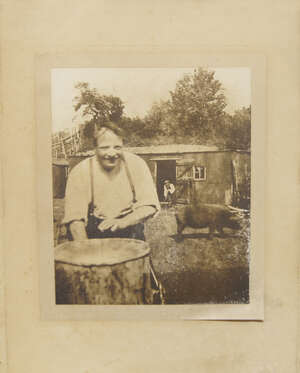 
	
		A photograph of a man and his pig, 29 x 24cm, mounted, framed and glazed, together with a...