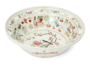 A Chinese porcelain deep bowl, early 19th century, painted in famille rose enamels to the...