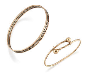 Two bangles, comprising: a rope-work slide design bangle with bead terminals; and an openwork  two colour bangle, internal diameter 8.1cm (2)