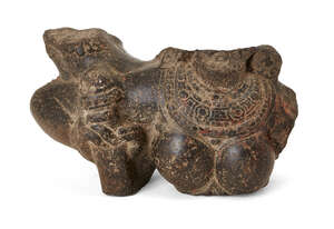 
	
		A polished stone fragment of a female courtesan, South India, 14th/15th century, her...