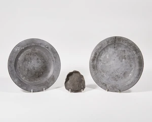 Two London pewter alms dishes and a lead 'Billy and Charley' pilgrim medal, 19th century, the...