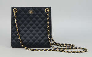 
	
		Chanel: a black leather and quilted silk shoulder bag, with gilt metal and silk rope...