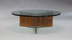
	
		A contemporary glass coffee table, of recent manufacture, the circular glass top, on...