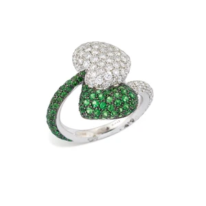 An Italian tsavorite garnet and diamond ring, designed as overlapping hearts pav&eacute; set with...