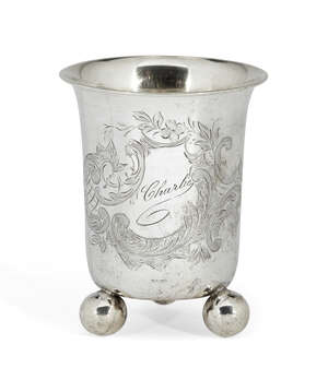 
	
		An engraved German silver beaker on three ball feet, stamped 800, the body of the beaker...