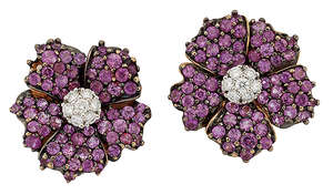 
	
		A pair of pink sapphire and diamond flowerhead cluster earclips, the brilliant-cut...