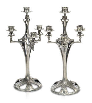 Art Nouveau, a pair of large pewter candelabra
		c.1900, possibly German, unsigned
		Each with four screw attached and removeable sconces, with open work ste