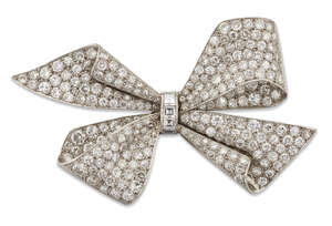 
	
		An Art Deco, diamond brooch, designed as a ribbon  bow, pave-set with brilliant-cut and...
