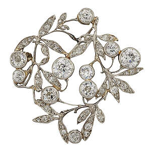 A Belle Epoque diamond brooch, designed as an openwork floral cluster spray set with old-brilliant-cut diamond collets and diamond leaf detail with rose-cut di
