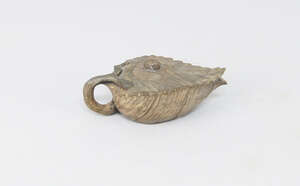 
	
		A Chinese Yixing leaf form water dropper, with a trailing vine handle and fruit form...