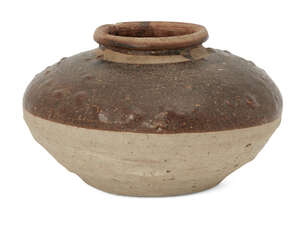 
	
		A large Chinese stoneware jar, Yuan dynasty, of compressed globular form, the brown glaze...
