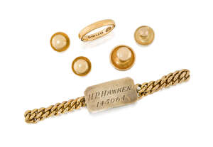 A small group of jewellery and dress accessories, comprising: a 22ct gold band ring, London hallmarks, 1917, 4.5g; an identity bracelet, the central cut-corner