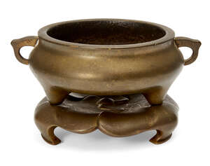 
	
		A Chinese polished bronze censer and stand, 18th/19th century, of typical squat form,...