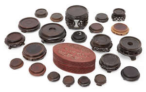 
	
		A collection of Chinese wood stands, 18th-early 20th century, 4cm - 10cm diameter, and a...