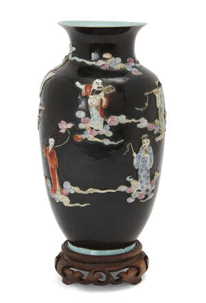 
	
		A Chinese famille rose 'eight immortals' vase, 19th century, of tapered form standing on...