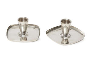 
	
		A.E. Jones, a pair of silver candlesticks
		Mark of A.E. Jones, Birmingham 1972
		Each...