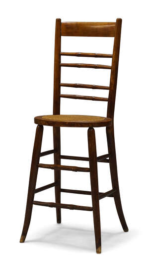 
	
		A Victorian mahogany and caned child's correction chair, with plain top rail over four...