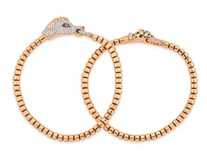 Two diamond set bracelets, the panels designed as diamond set horse and leopard heads, each with...