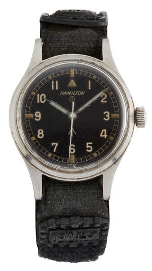 
	
		A stainless steel, British military issue wristwatch by Hamilton, the black dial with...