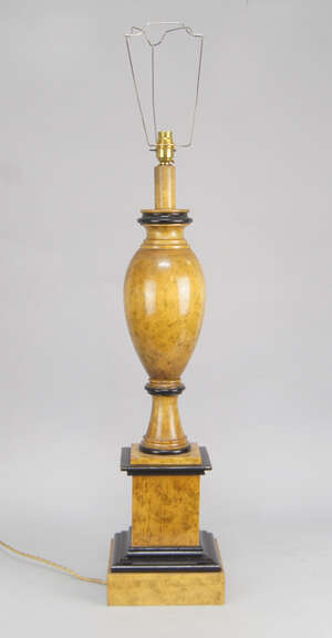 
	
		A burr and ebonised wood baluster turned lamp base, 20th century, on a square stepped...