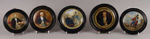 A Staffordshire pot lid of the late Duke of Wellington, in an ebonised frame, 11.5cm diameter, together with another portrait of Wellington, a pot lid for the 