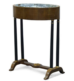 
	
		A Continental mahogany, ebonised and parcel gilt jardinière stand, 19th Century, the oval...