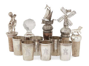 
	
		Two Dutch .833 silver bottle stops and a set of six German silver liqueur cups, one...