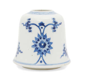 A Chinese porcelain bell-shaped vase, Kangxi period, painted in underglaze blue with stylised lotus flowers, floral sprays, and two shou characters, 11cm high
