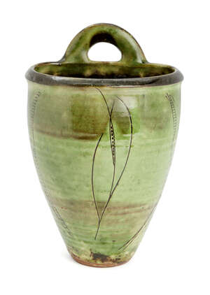 
	
		Michael Cardew (1901-1983), an earthenware wall pocket 
		c.1930-40, impressed seals to...