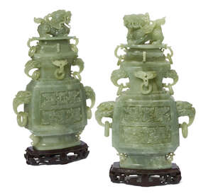 
	
		A pair of Chinese green hardstone vases and covers, late 20th century, carved in the...