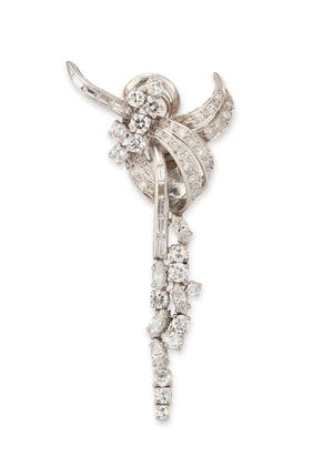 A single diamond set ear clip,&nbsp;designed as a brilliant-cut, single-cut and baguette-cut diamond...