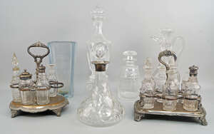 
	
		A cut glass ships decanter, with silver collar, three further glass decanters, a...