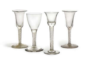 
	
		A George III wine glass, mid 18th century,  with plain bowl, on opaque ribbon and lattice...