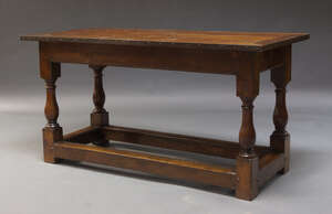 
	
		An oak refectory table, early to mid 20th Century, the metal bound three plank top, on...