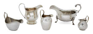 An assortment of five silver cream jugs, various dates and makers, including one raised on a circular foot with reeded edge, London, c.1803, Thomas Streetin, t